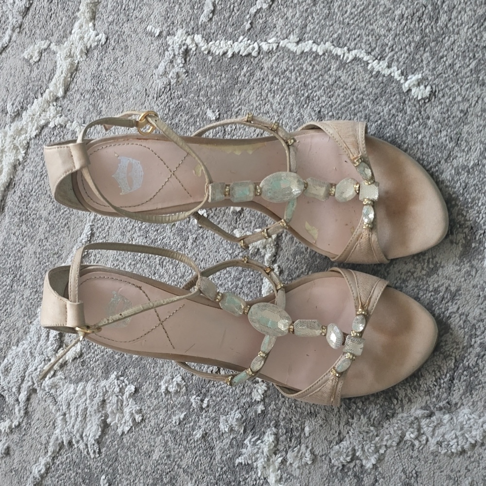 Cream heels with stones and leather sole in size 8.5.